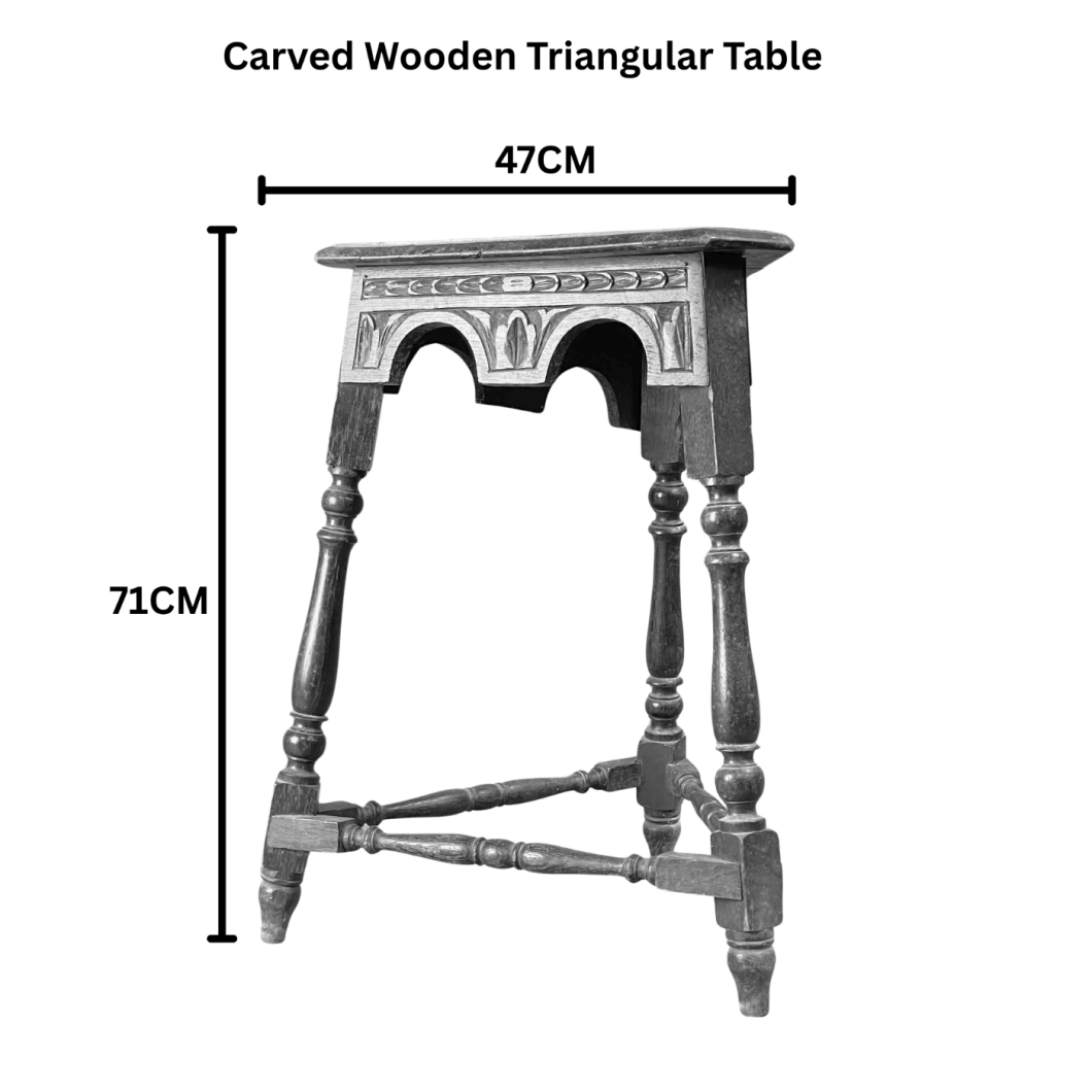 CARVED WOODEN TRIANGULAR TABLE.png