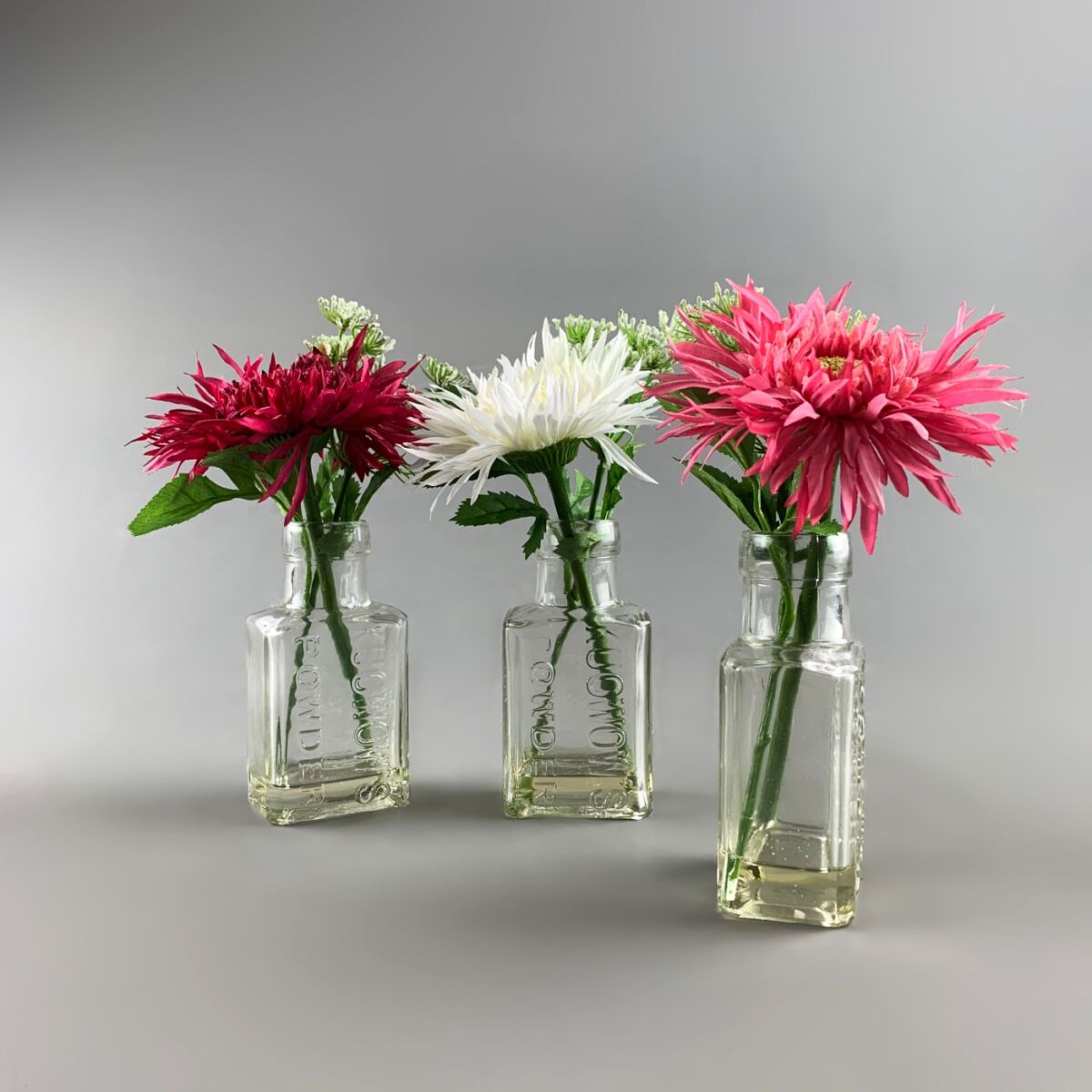 Flowers in Chemist Bottle, Gerbera Arrangement, 25 cm artificial flower &  foliage decor. Set of 3